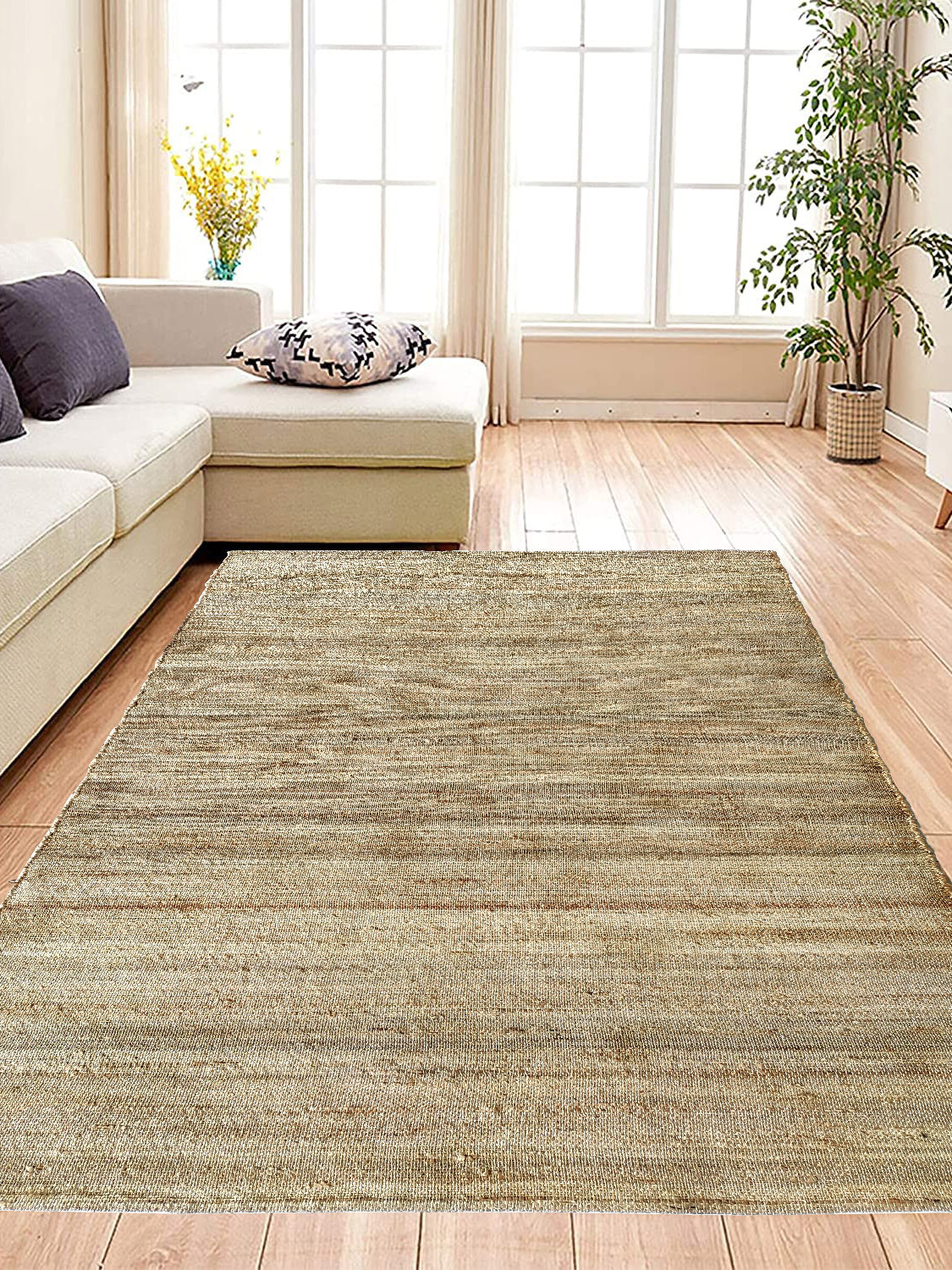 Handmade woven rug in a soft, neutral color palette for indoor or outdoor use