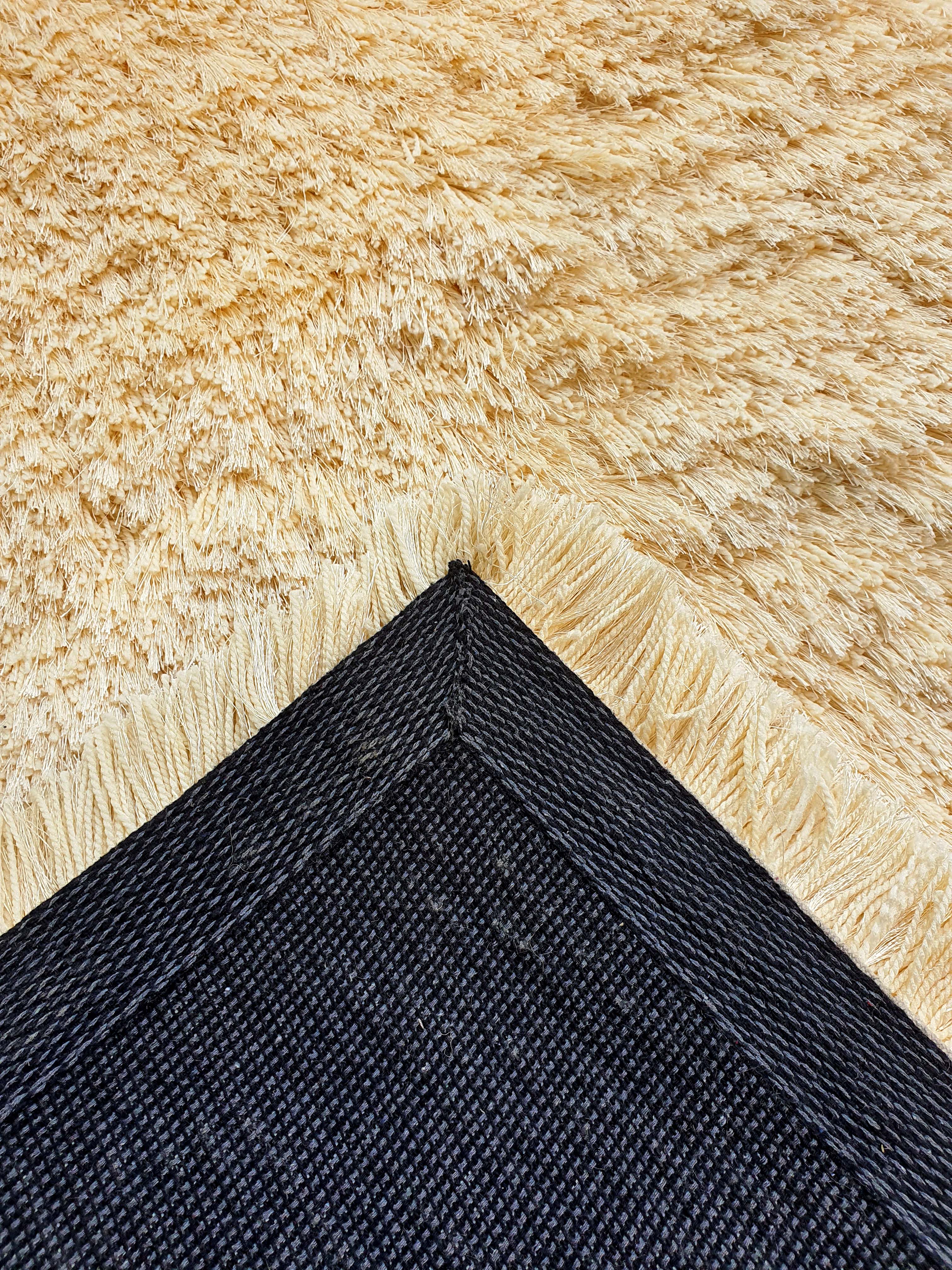 Indulge in luxurious softness with our Cream Shaggy Rugs and Carpet