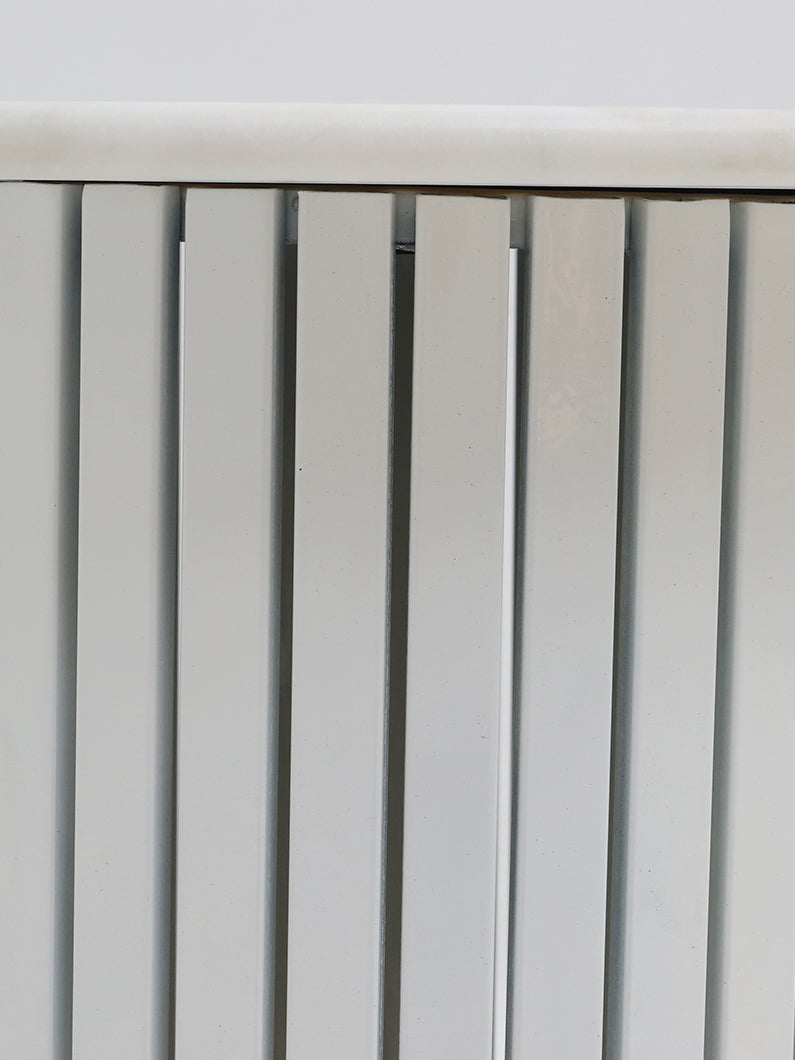 Side close-up detailing the elegant white gloss marble and the sturdy construction, merging functionality with refined aesthetics.