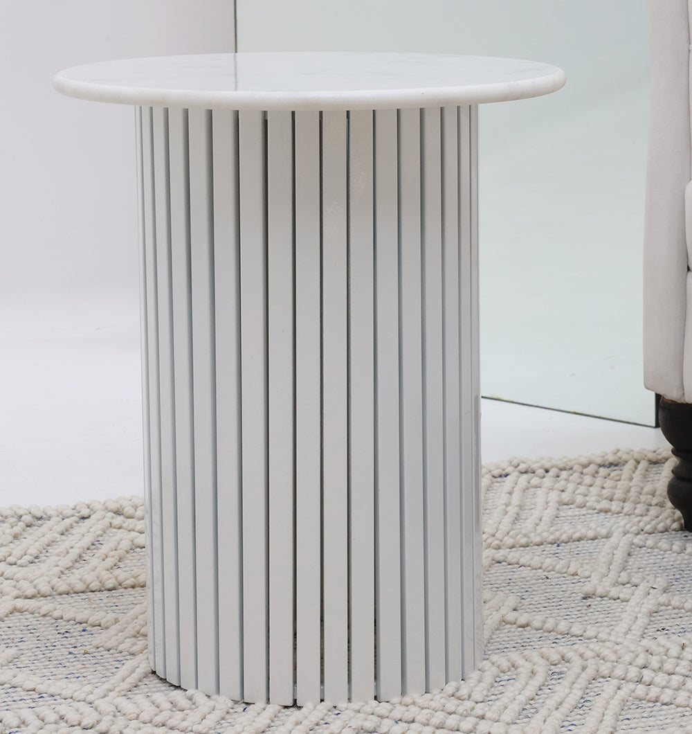 Round white marble center table enhancing the living space, perfect for gatherings and complementing any decor style.