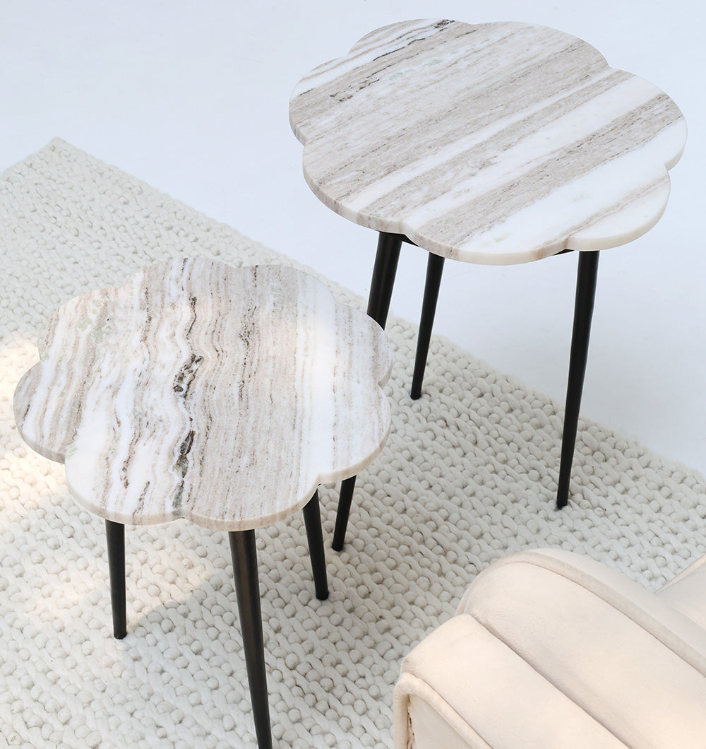 CloudForm nesting marble tables placed in a living room, combining contemporary design with functional elegance.