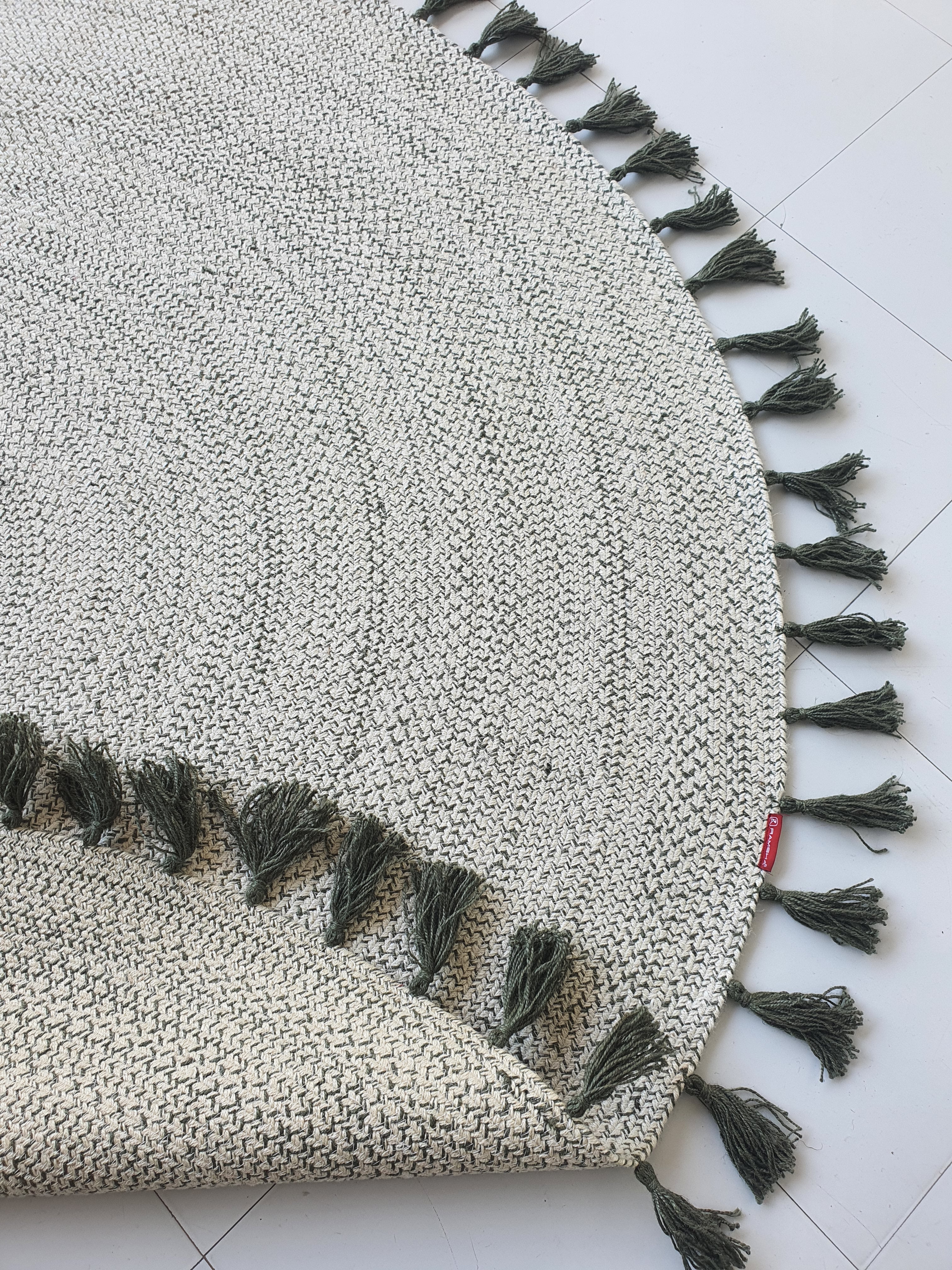 Backside of the round braided rug, confirming the solid construction and meticulous braiding of the jute material.