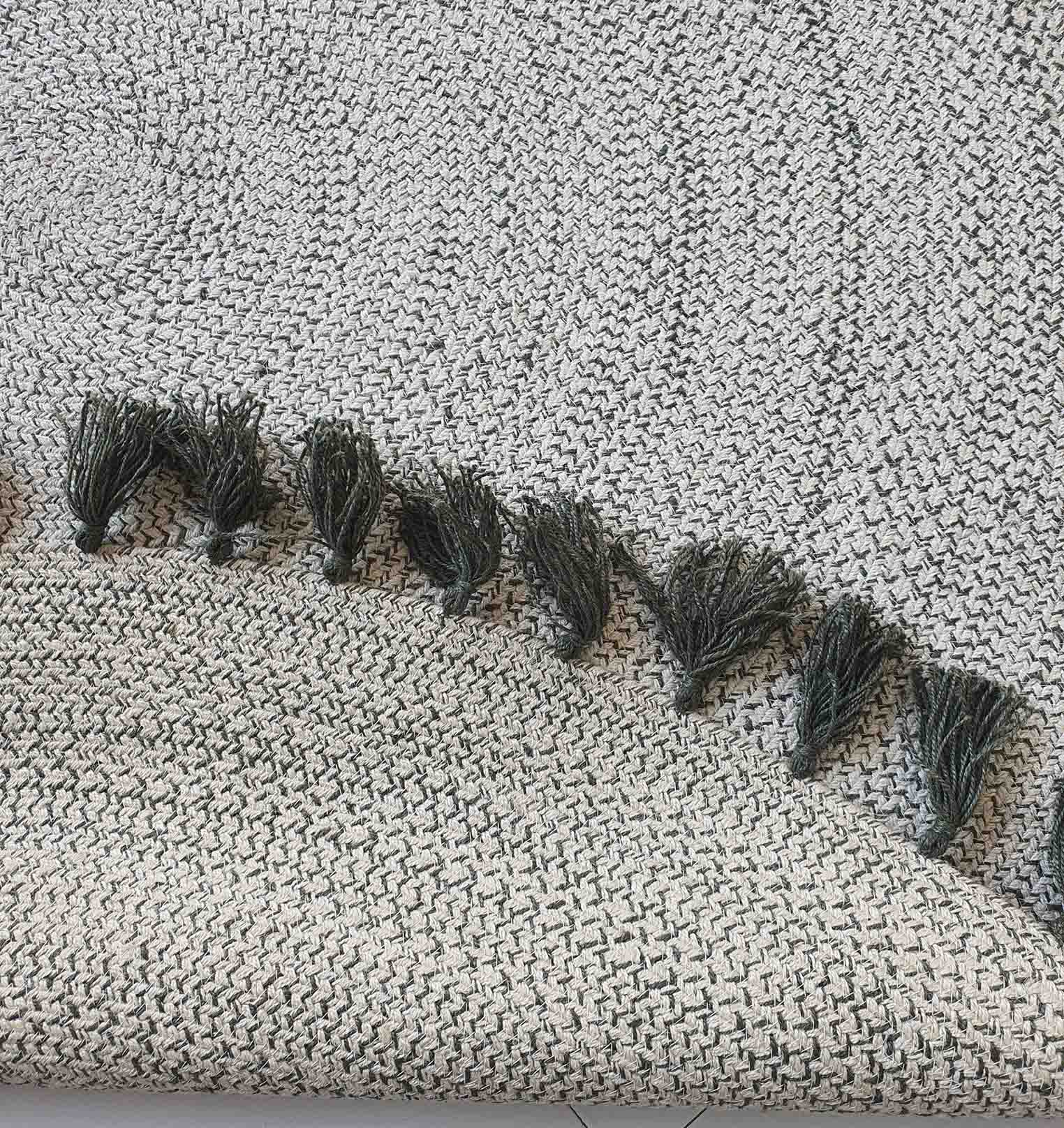 Backside of the round braided rug, confirming the solid construction and meticulous braiding of the jute material.