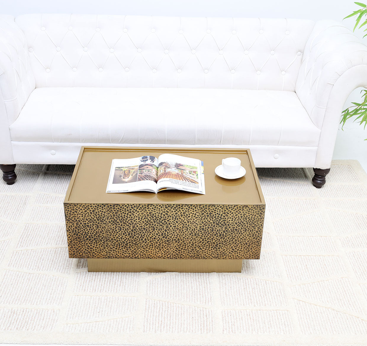 Add a touch of luxury with this rectangular iron side table featuring a golden textured finish.