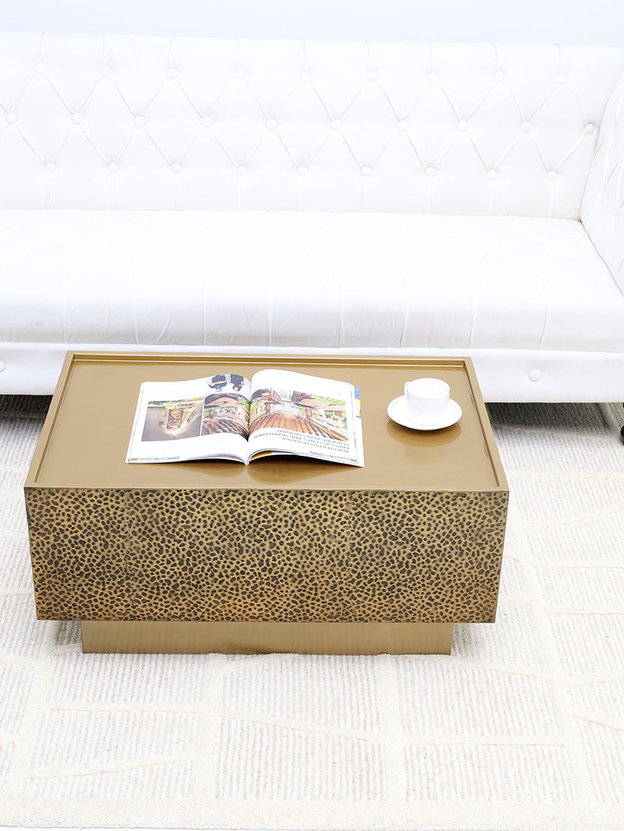 Add a touch of luxury with this rectangular iron side table featuring a golden textured finish.
