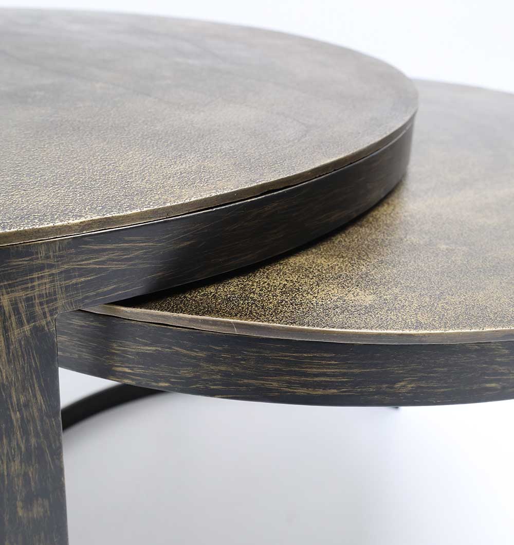 Space-saving coffee tables featuring smooth wood surfaces and minimalist metal bases.