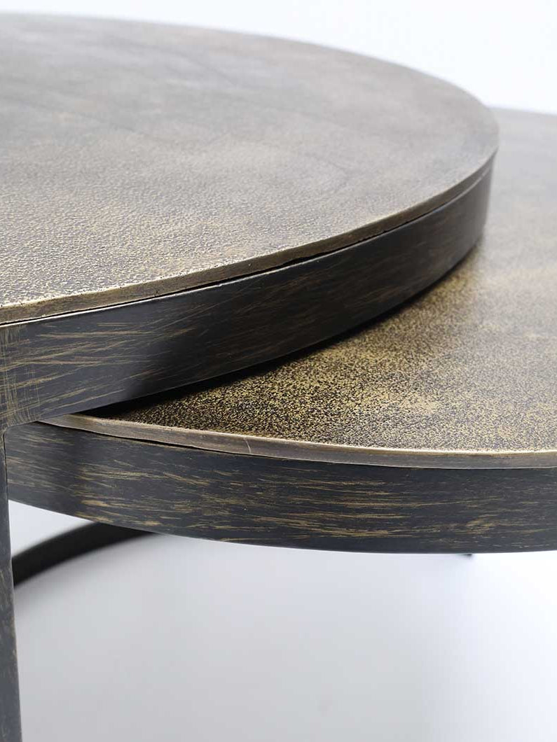 Space-saving coffee tables featuring smooth wood surfaces and minimalist metal bases.