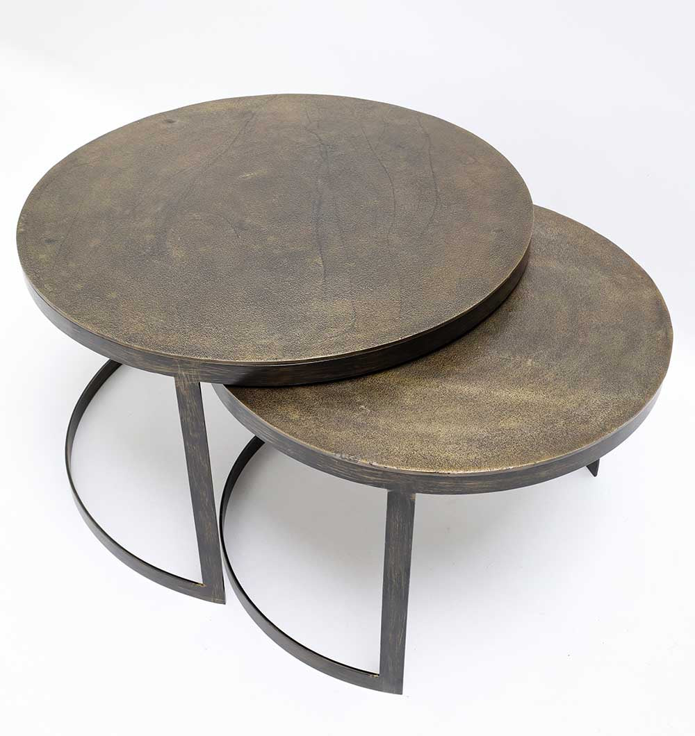 Stylish trio of nesting coffee tables combining warm wood finish and industrial metal legs.