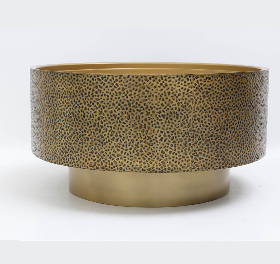 Luxury accent table showcasing golden iron craftsmanship and a textured top.