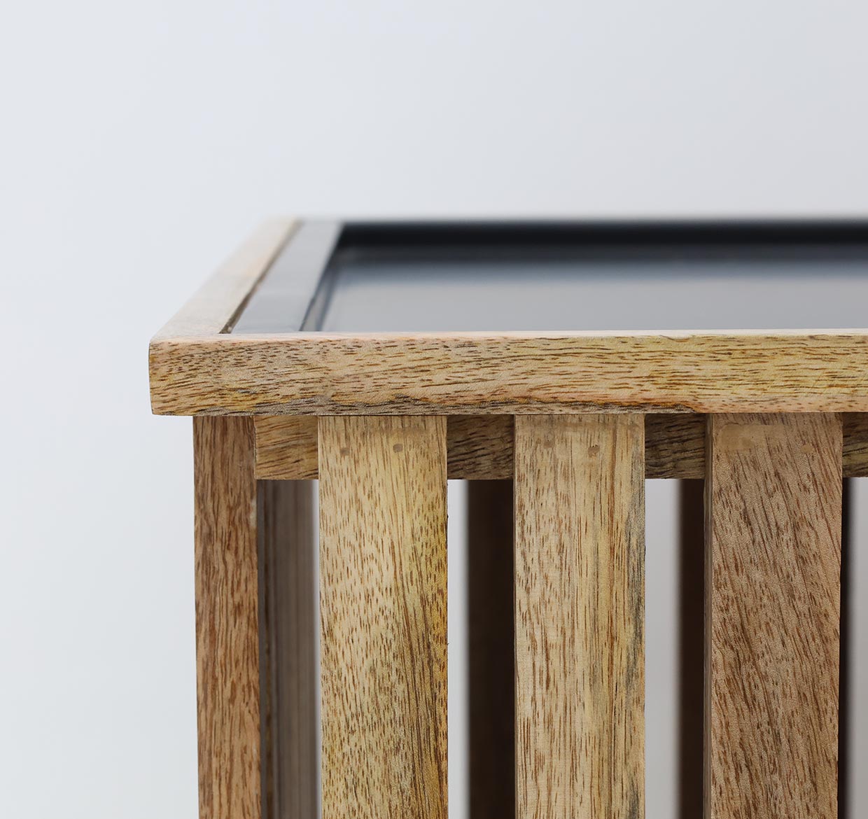 Square slatted coffee table with solid wood top and black iron frame.