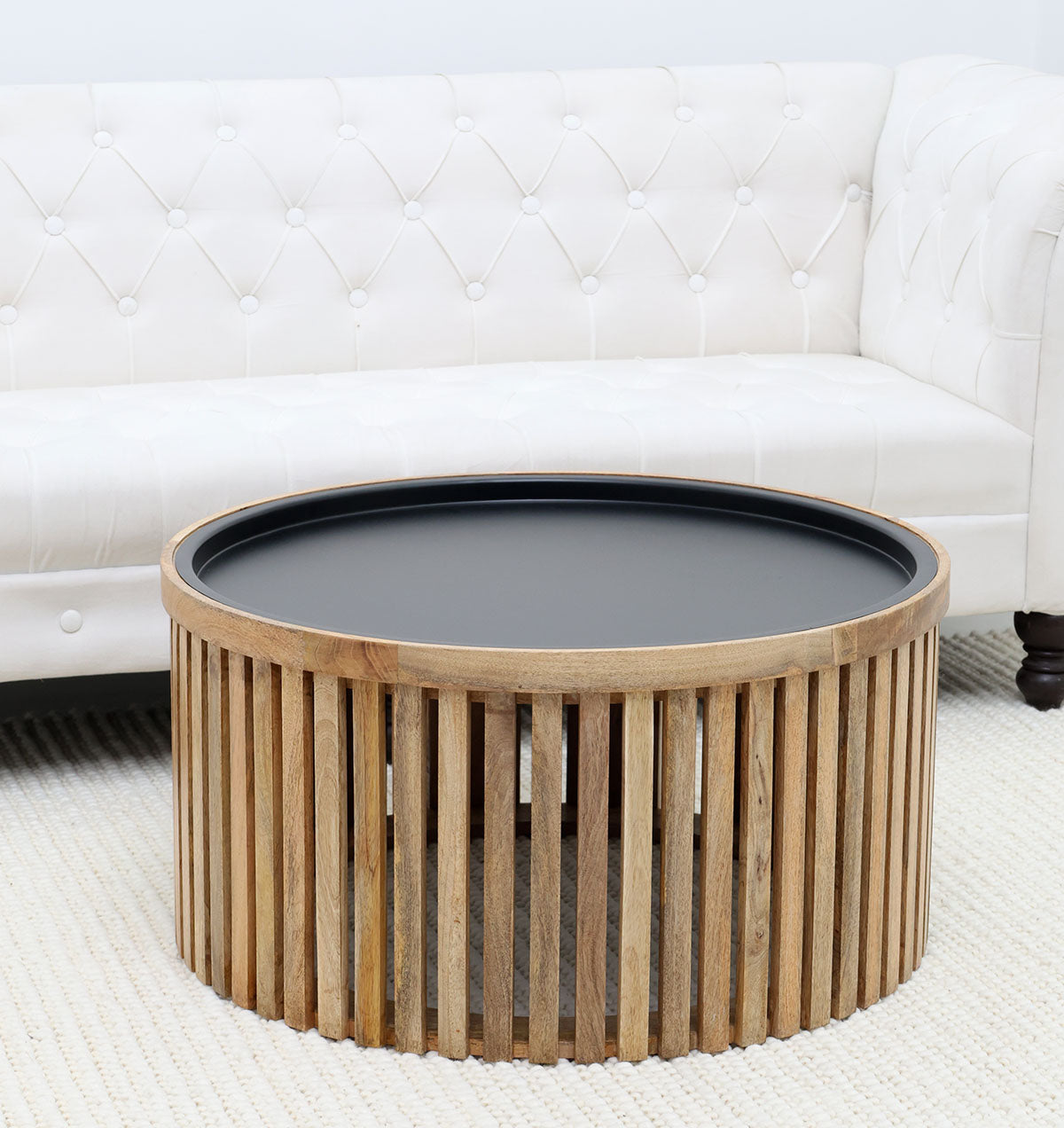 Luxury round coffee table with slatted wooden top and iron base, ideal for stylish living room decor.