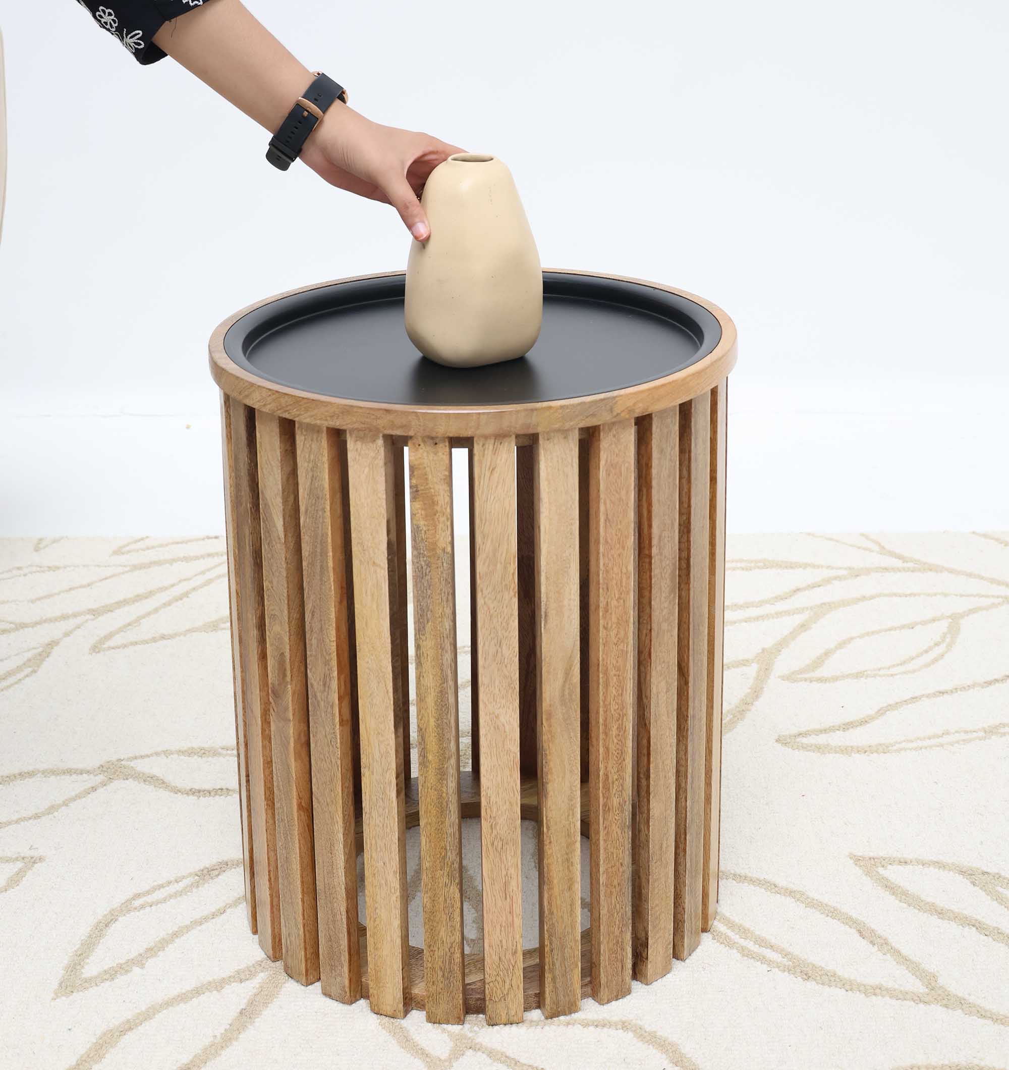 Industrial-style coffee table with natural wood finish and cylindrical iron frame.