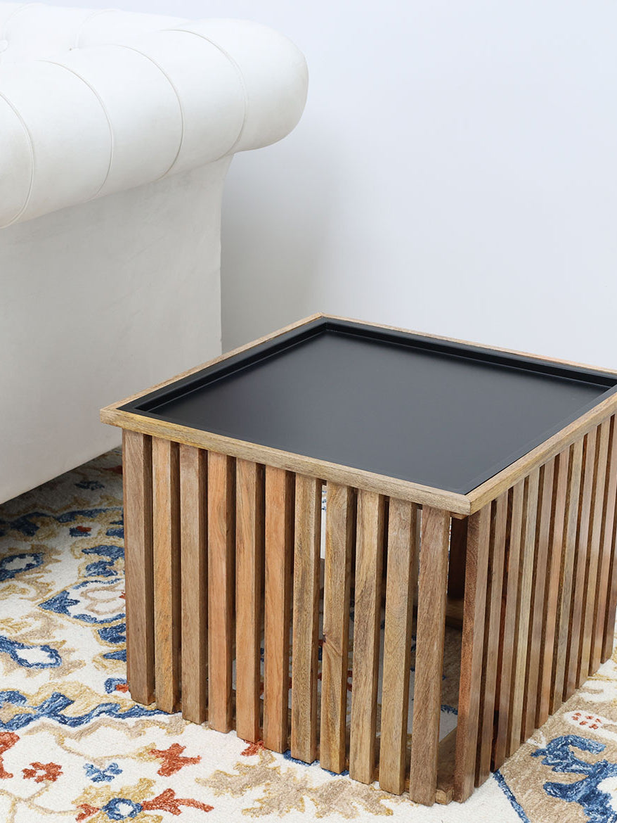 Modern square coffee table with slatted wooden top and iron base.