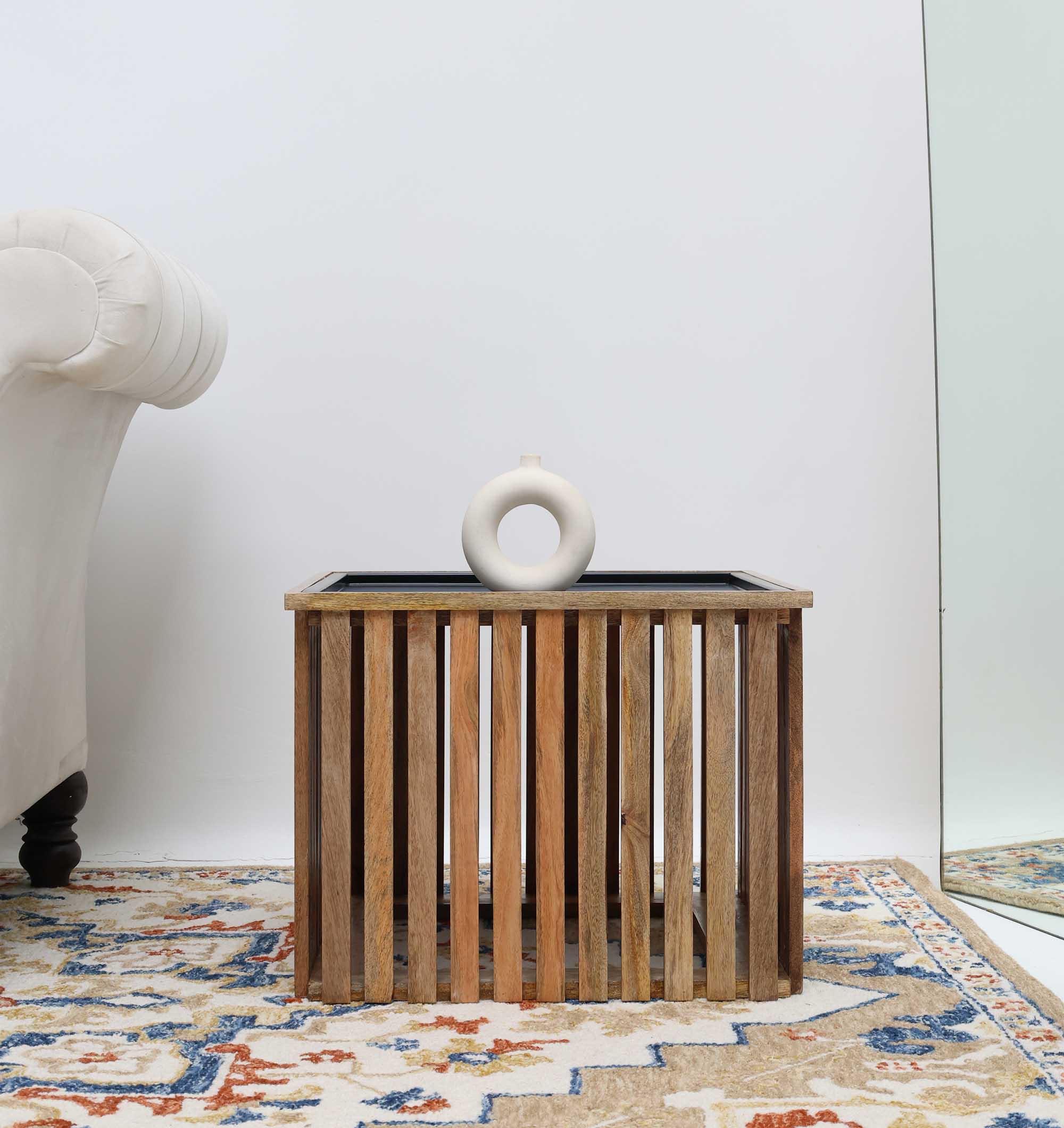 Elegant living room centerpiece with square wood surface and iron structure.