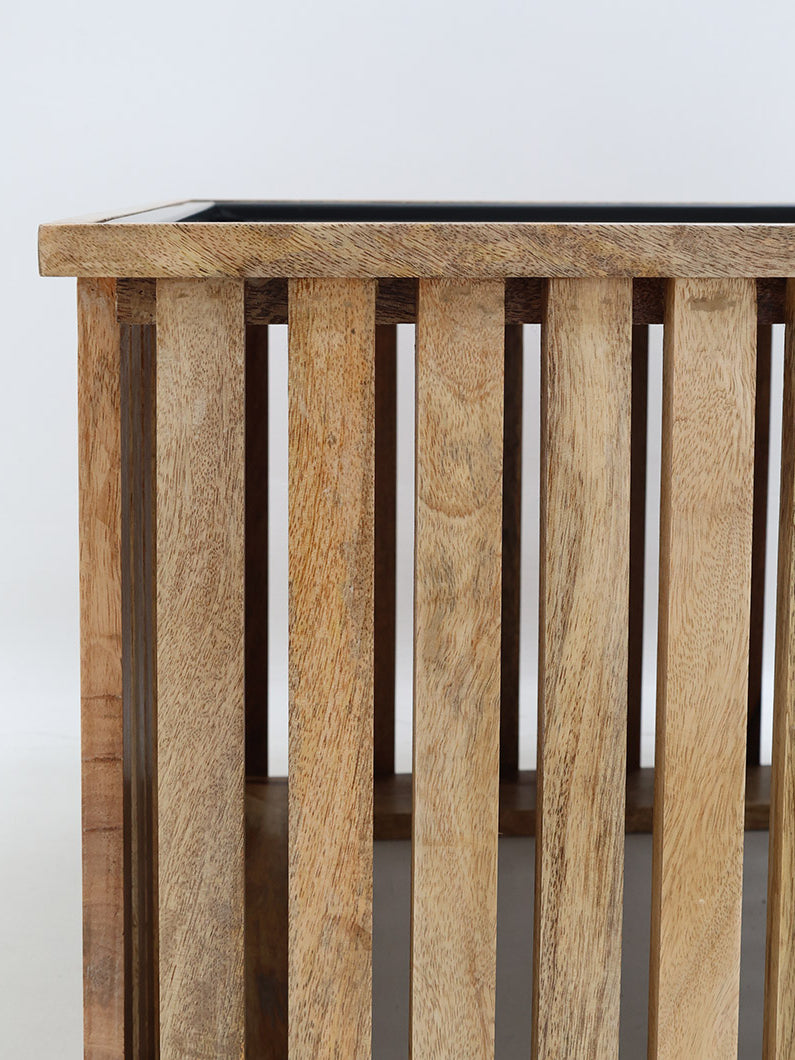 Stylish wooden and iron coffee table featuring a square slatted design.