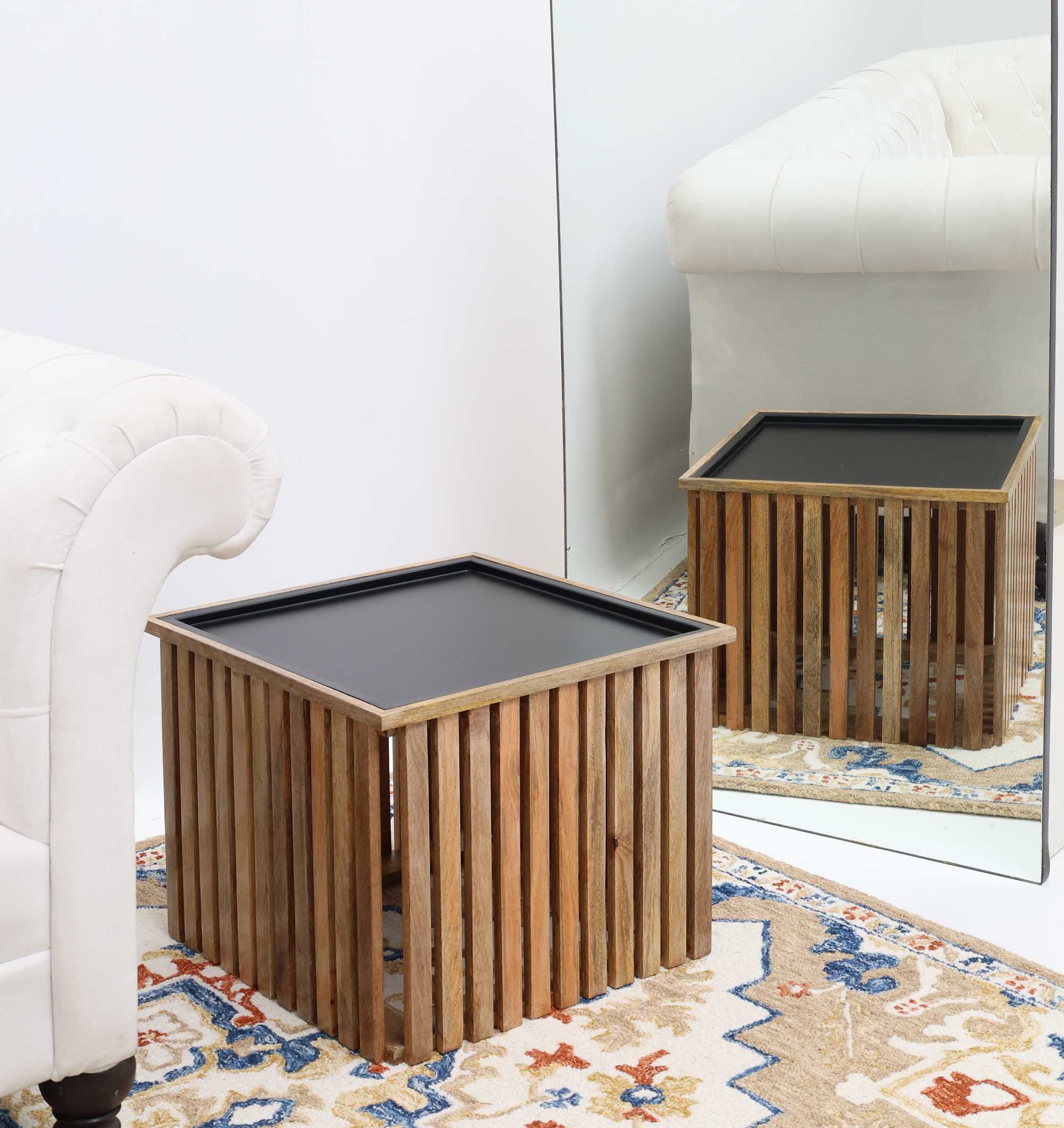 Square coffee table with natural wood slats and sleek black iron frame.