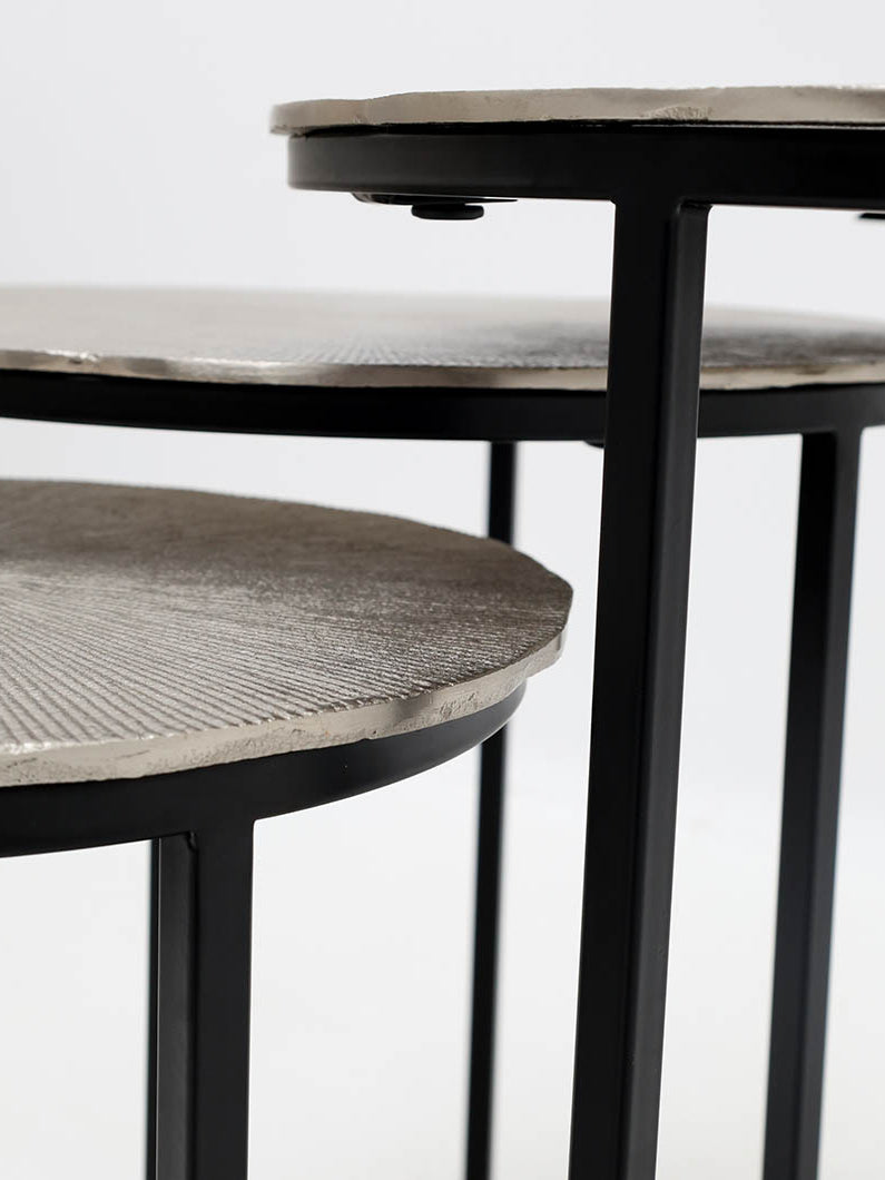 Stylish brass-finished side table set with grey iron frames, ideal for modern interiors.