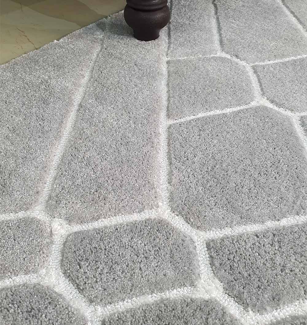 Close-up detailing the durable synthetic pile and stain-resistant fibers of the 80% polyester blend.