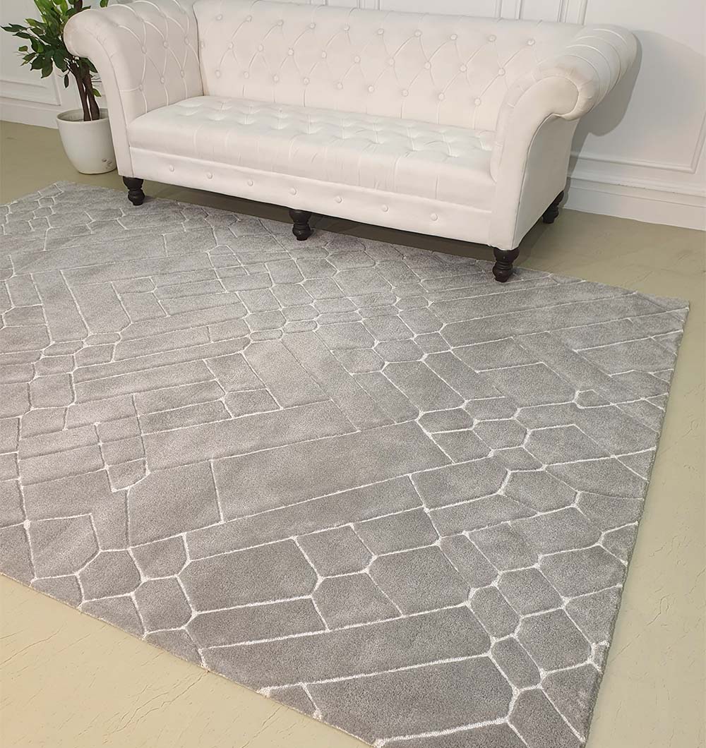 Hand-tufted rug anchoring a room, showcasing the color richness and modern aesthetic of the multi-color design.