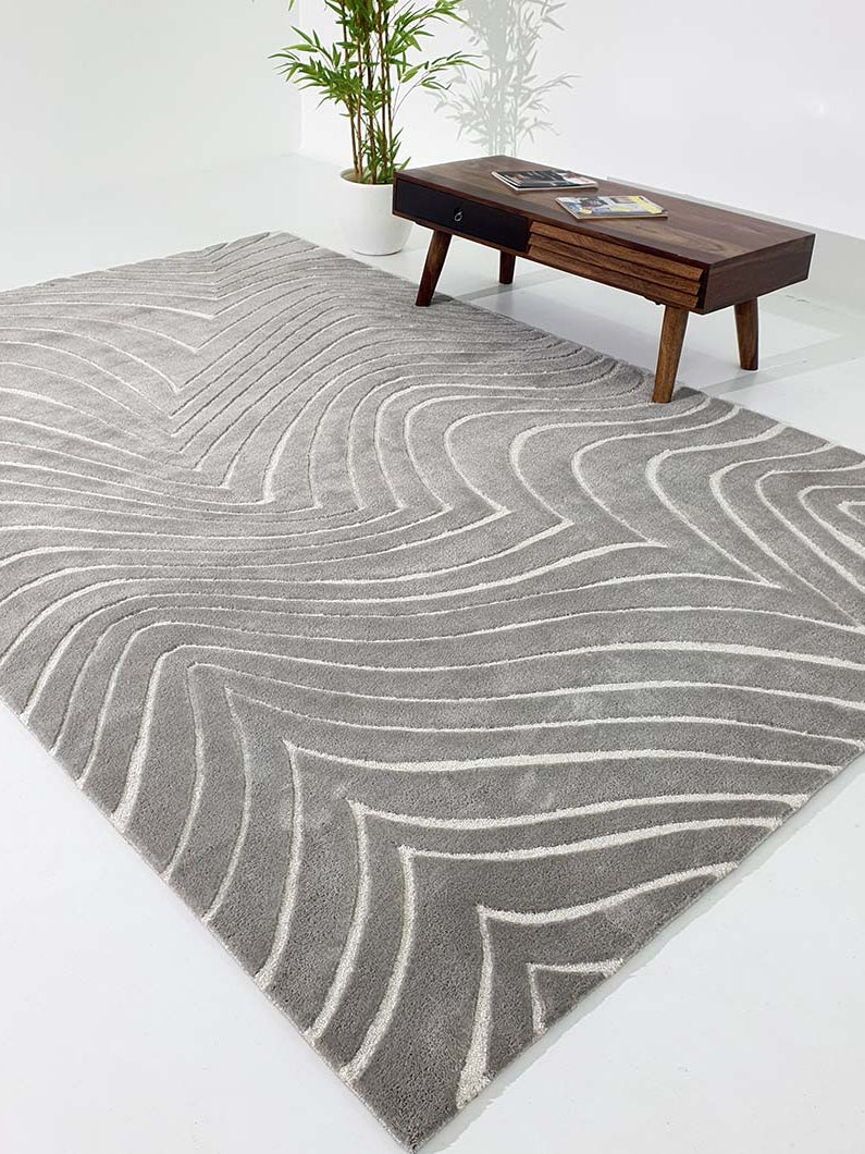 Multi-color rug in a home setting, showcasing the dimensional geometric pattern and multi-hued look.