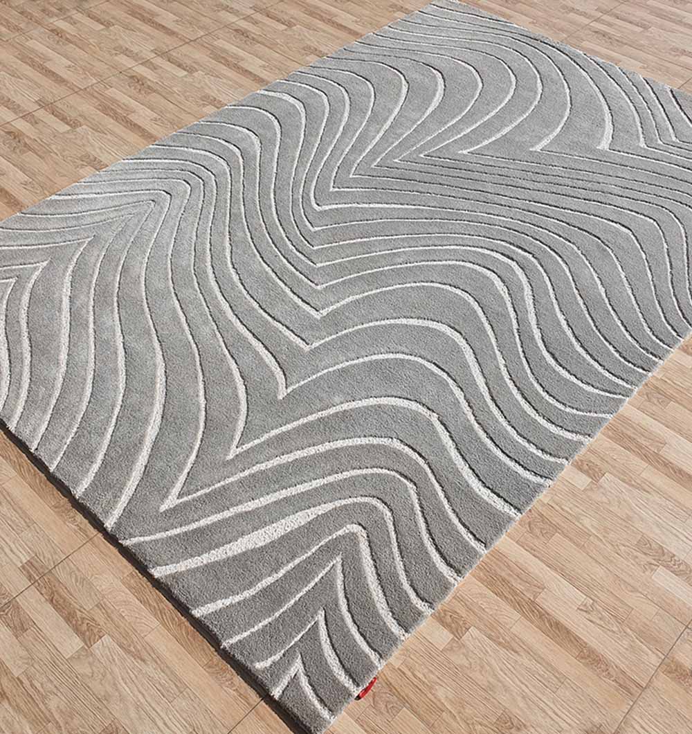 Side angle view highlighting the hand-tufted finish and density of the pile construction.