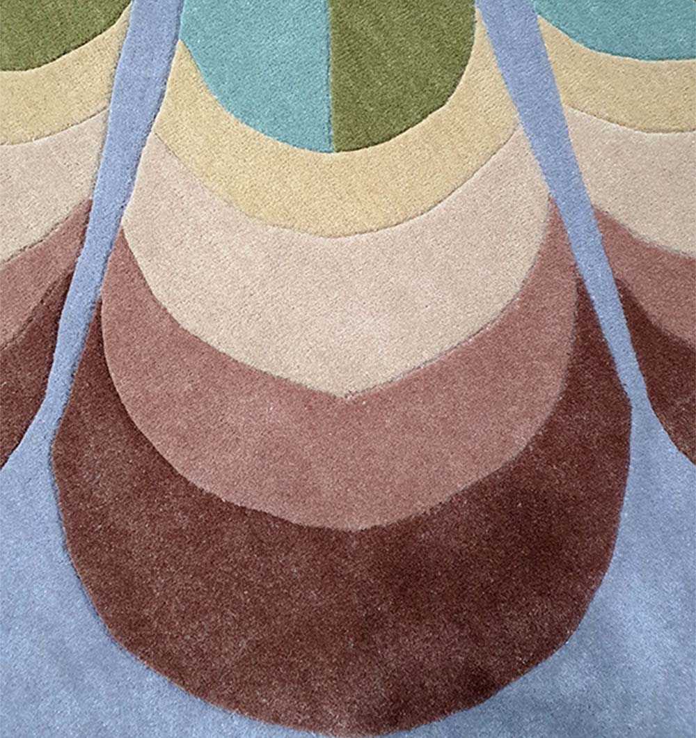 Circular floor accent defining a lounge space, showcasing the spectrum of colors and natural fiber surface.