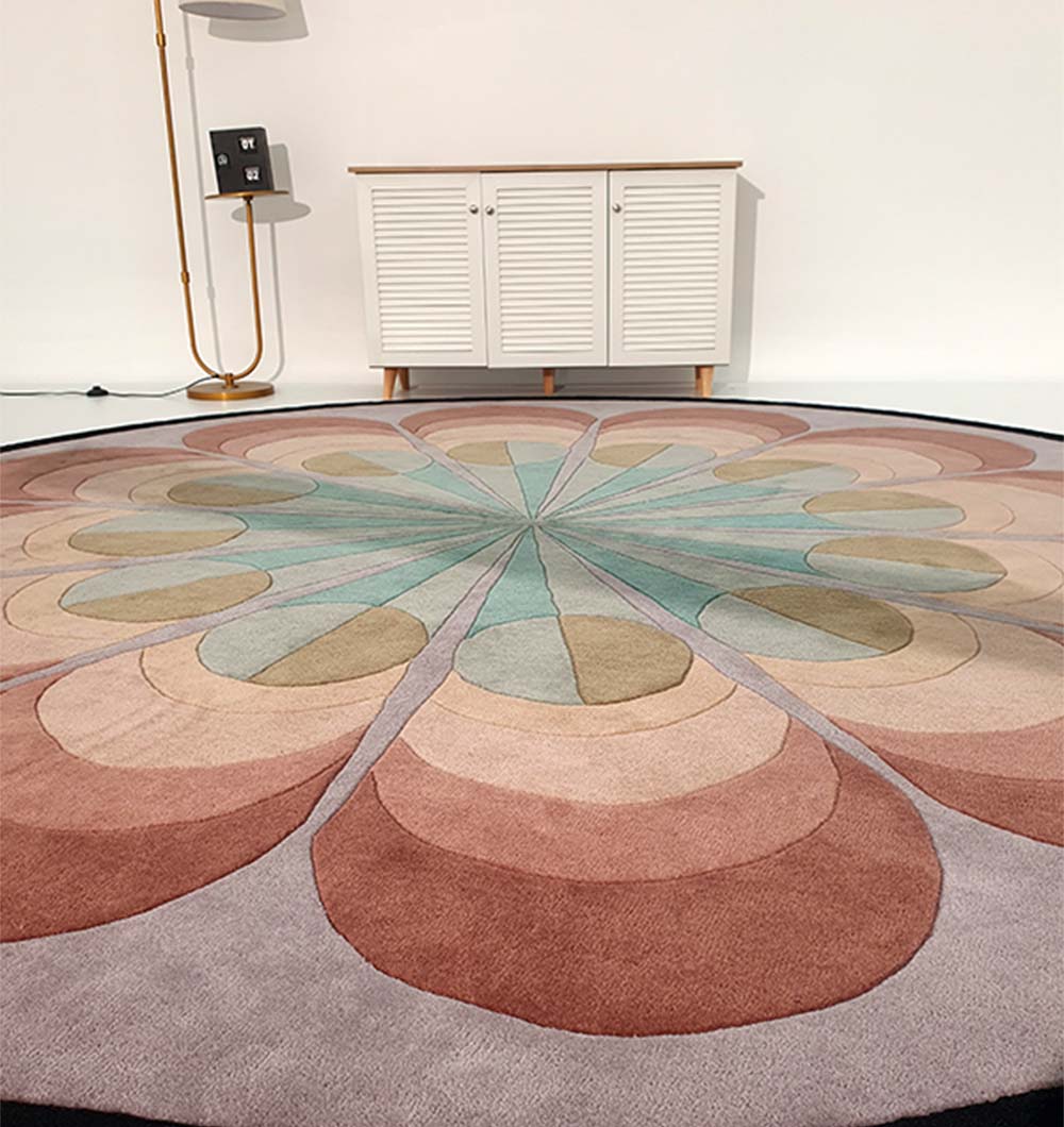 Round carpet anchoring an entryway, highlighting its dense weave and quality hand-tuft construction.