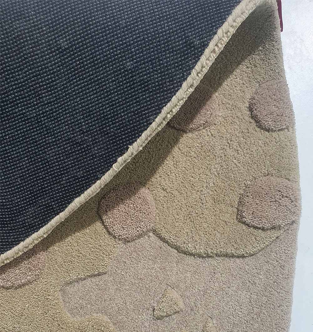 Backside of the round area rug, confirming the heavy-duty construction and long-lasting quality of the backing.