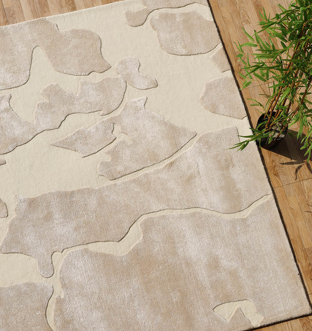 Angled shot of the beige handmade rug, designed with exceptional durability to withstand everyday use.
