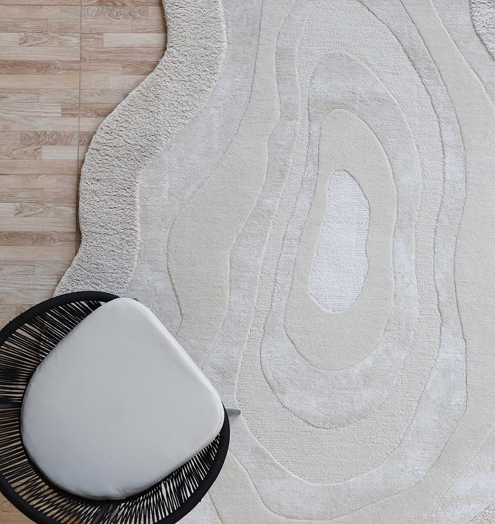 Side angle of the rectangular rug with a chair, showcasing its aesthetic sophistication and timeless elegance in the living room.