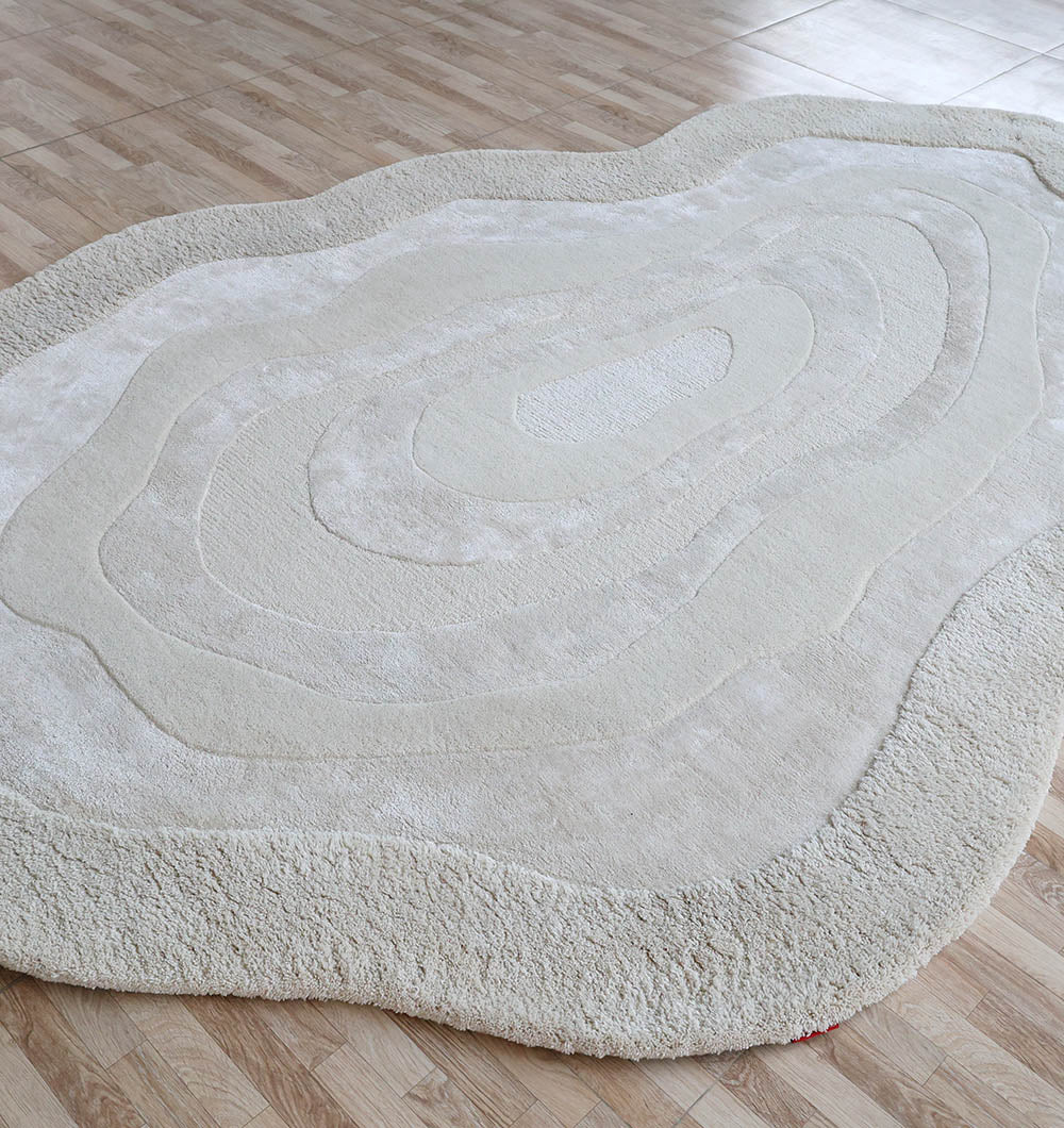 Handmade decor rug under a chair, highlighting its practical durability and excellent resilience for high-traffic spaces.