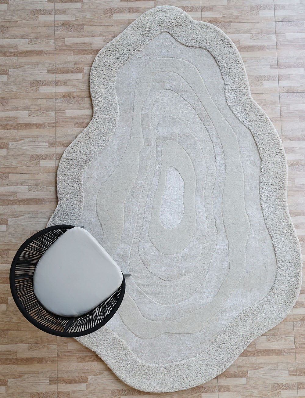 Handmade decor area rug in natural white, showcasing superior quality and aesthetic sophistication.