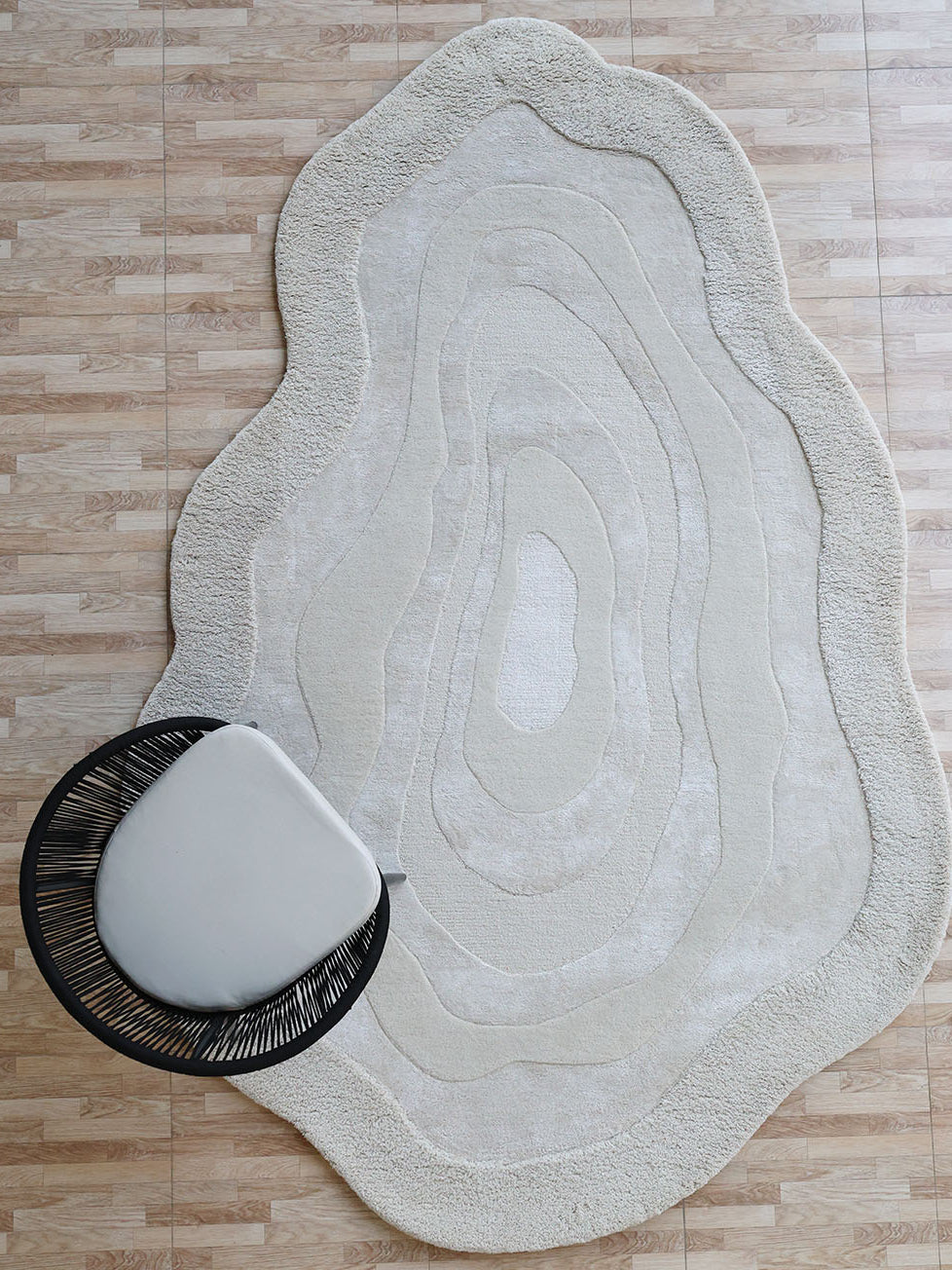 Handmade decor area rug in natural white, showcasing superior quality and aesthetic sophistication.