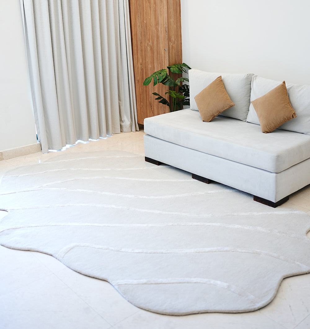 Handmade decor area rug in natural white, displaying superior quality and aesthetic sophistication.