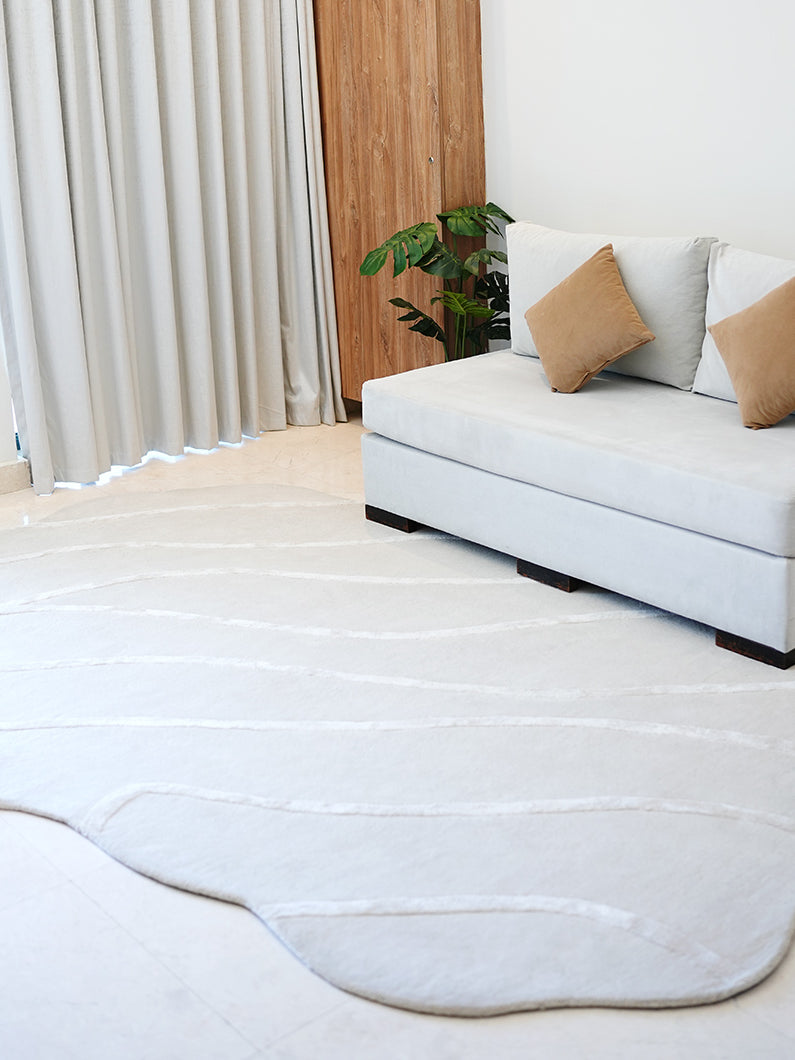 Handmade decor area rug in natural white, displaying superior quality and aesthetic sophistication.