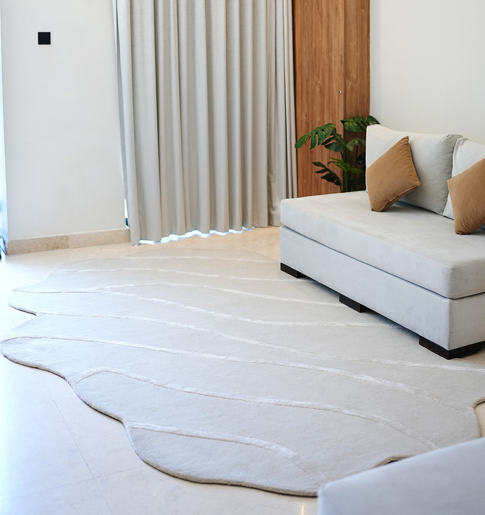 Angled view of the premium wool blend shaped rug in a dining area, adding unique character and excellent resilience to the space.