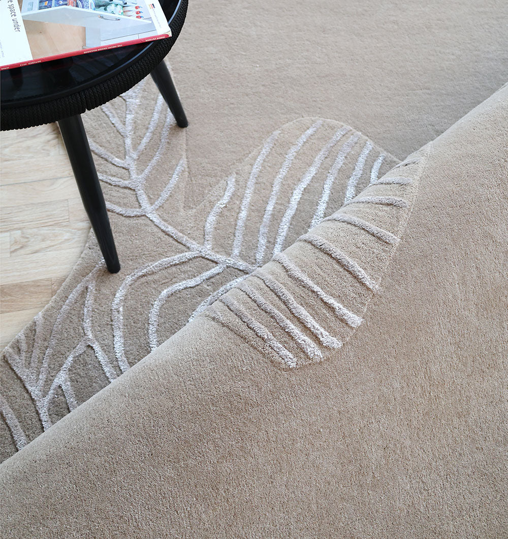 Close-up detailing the luxurious texture underfoot of the natural wool, viscose, and cotton fiber blend.