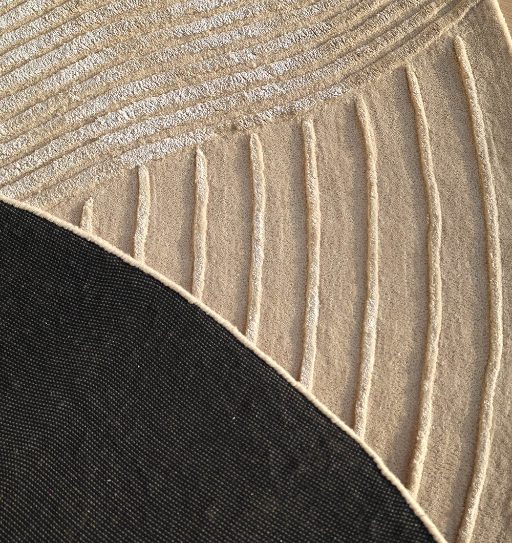 Backside of the round hand-tufted rug, confirming the individual craftsmanship and material composition for practical durability.