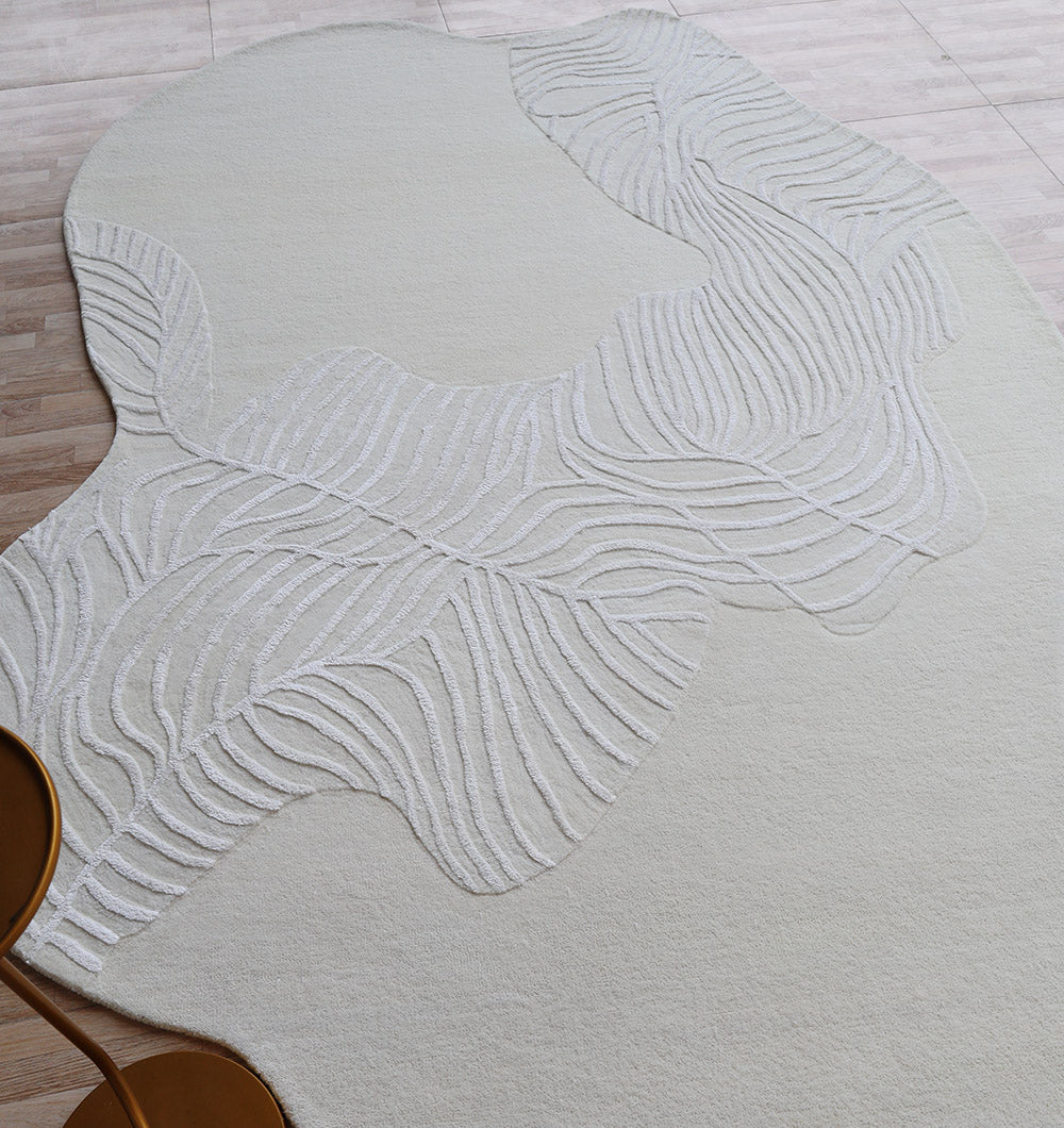 Angled view of the natural white leaf pattern rug, highlighting its practical durability and timeless elegance.