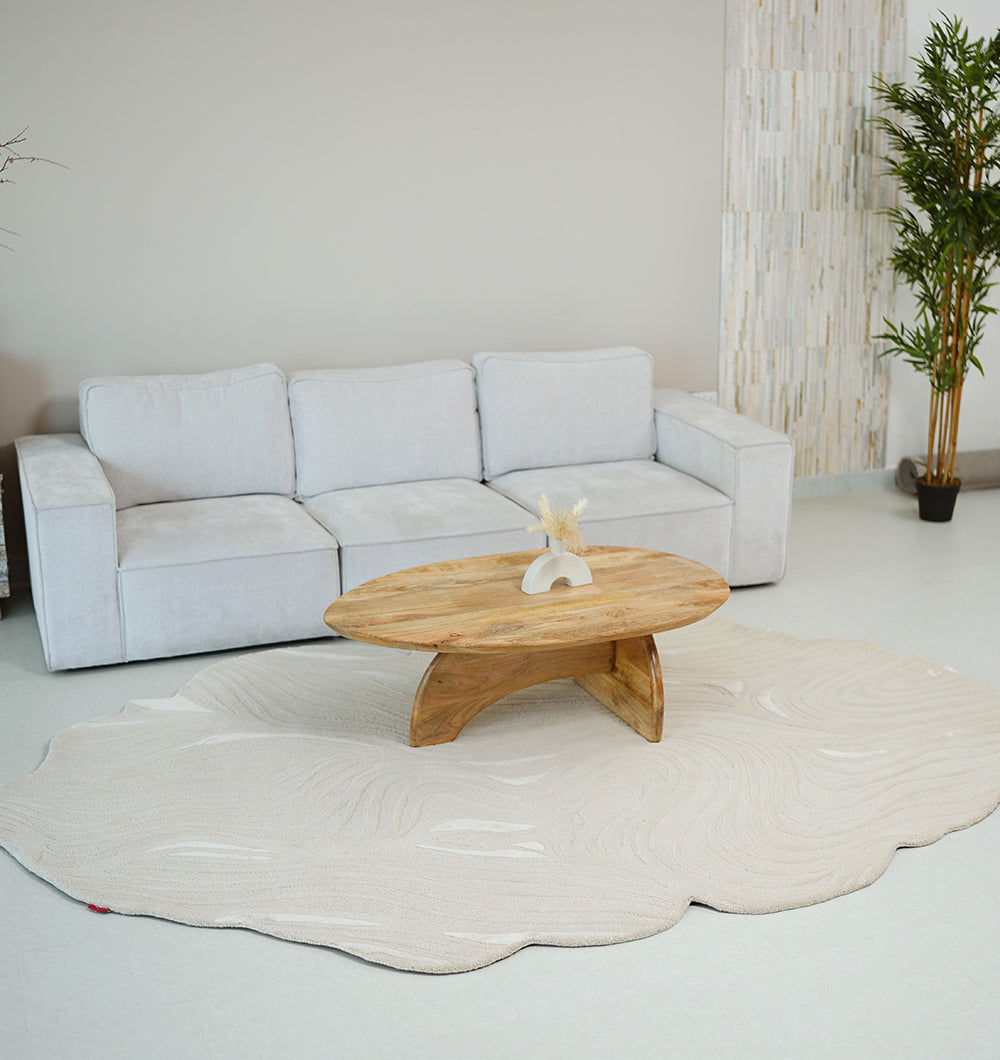 Irregular natural white rug placed in a bedroom, highlighting its superior quality and excellent resilience for high-traffic spaces.