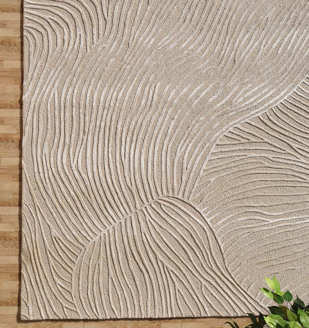 Side close-up of the rectangular rug's edge, highlighting the hand-tufted construction for practical durability in high-traffic spaces.