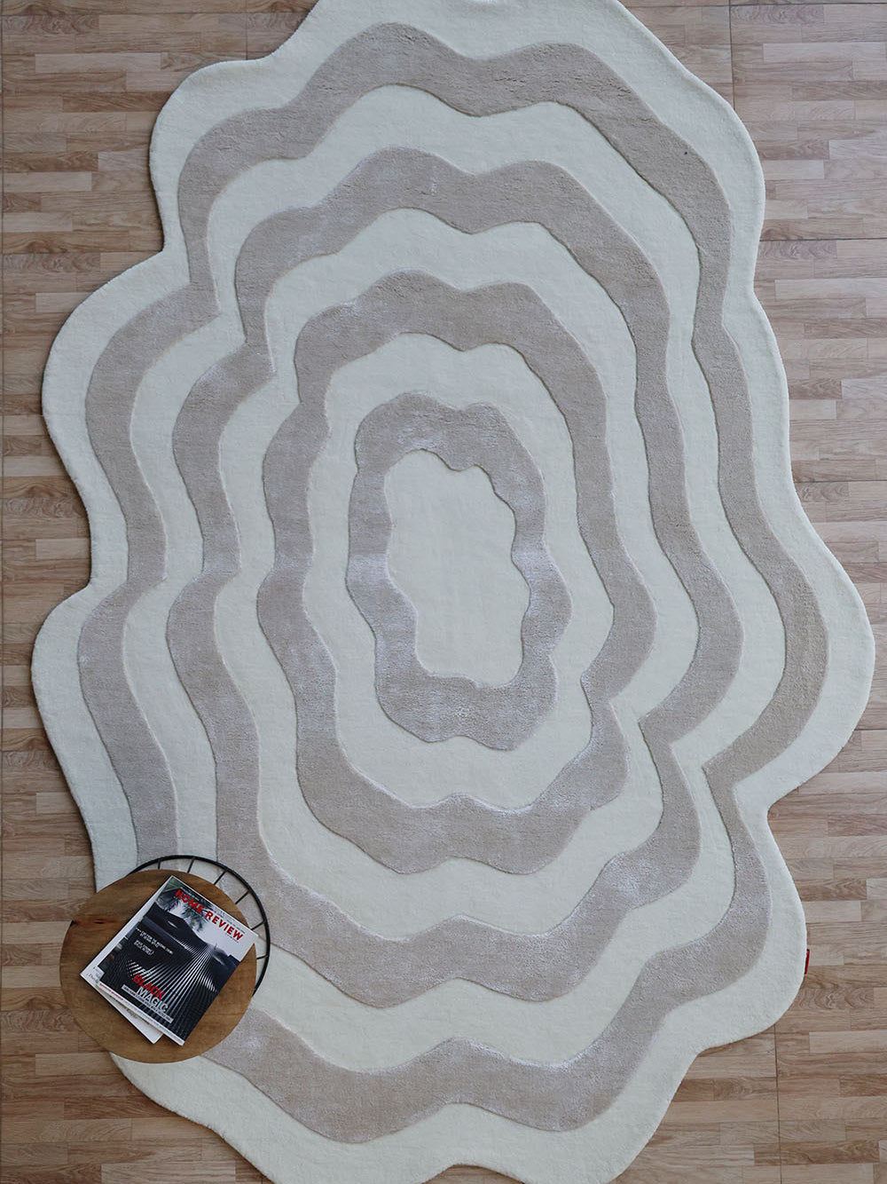Beige and cream wavy handmade area rug in an irregular shape, showcasing superior quality and aesthetic sophistication.