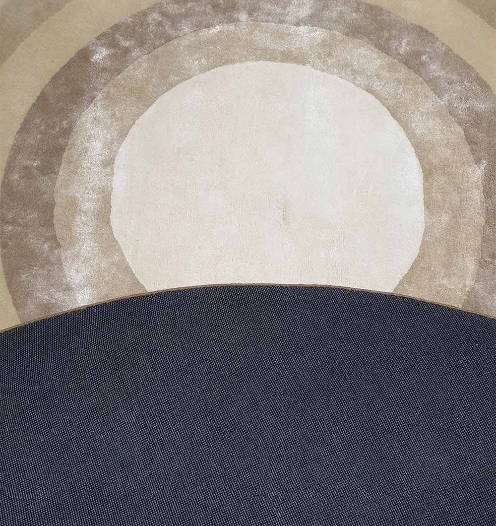 Reverse side of the rug, showing the base material used to anchor the wool pile and the construction's blended composition.