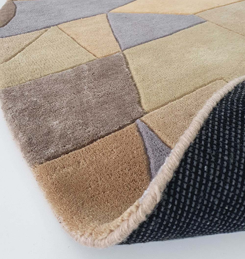 Backside view of the round carpet, confirming the durable backing and solid weave construction of the hand-tufted material.