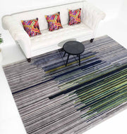 Rectangular multi-color rug placed in a living space, acting as a functional room anchor with its rich palette.