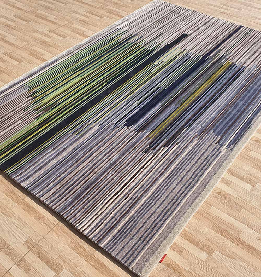 Side angle of the rectangular rug, showcasing the expert hand-tufted craftsmanship and heavy-duty construction.