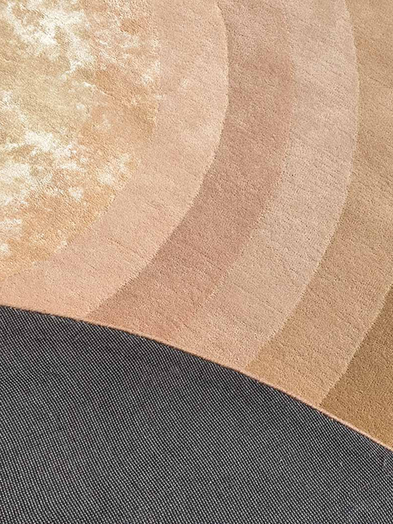 Backside of the round hand-tufted rug, confirming the finely crafted construction and quality backing.