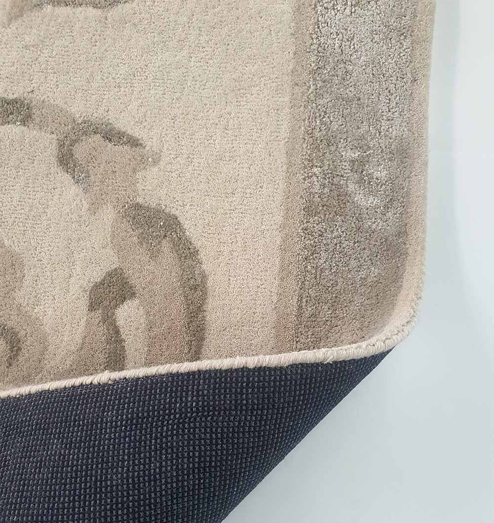 Backside of the multi-color hand-tufted rug, confirming the sturdy secondary backing and expert artisanal construction.