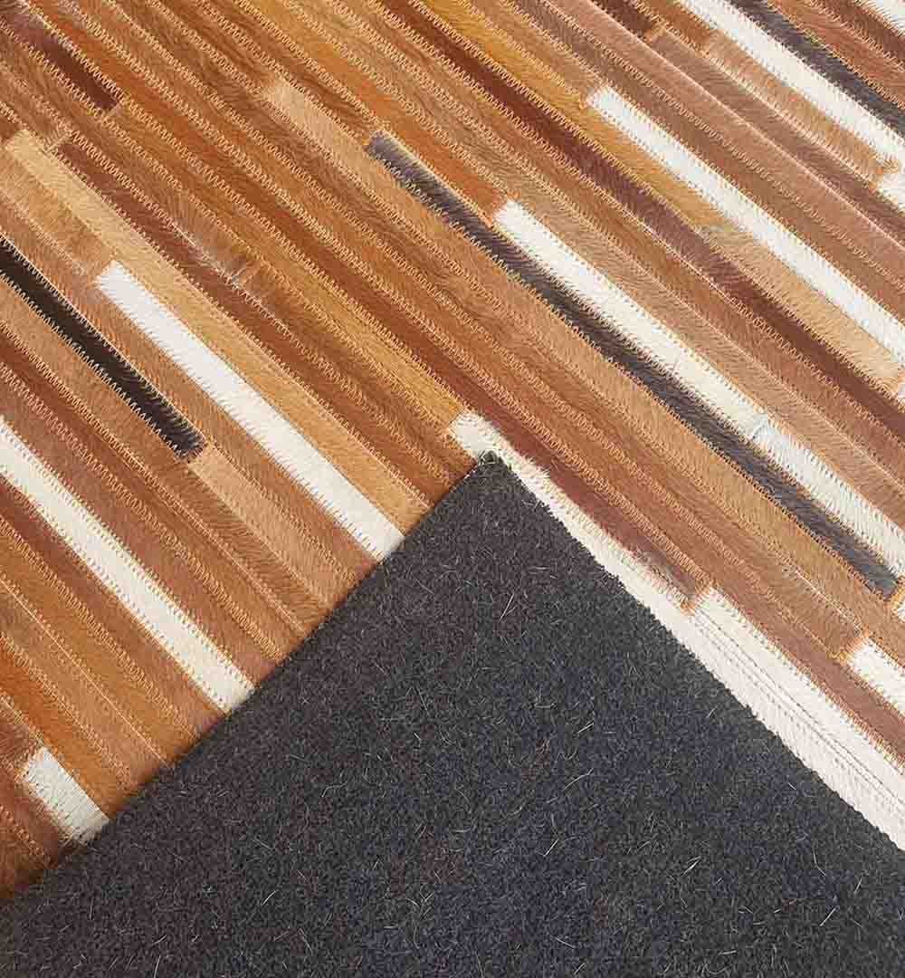 Close-up view of the backside of handmade leather rug LR-014 showing fine stitching and detailed craftsmanship