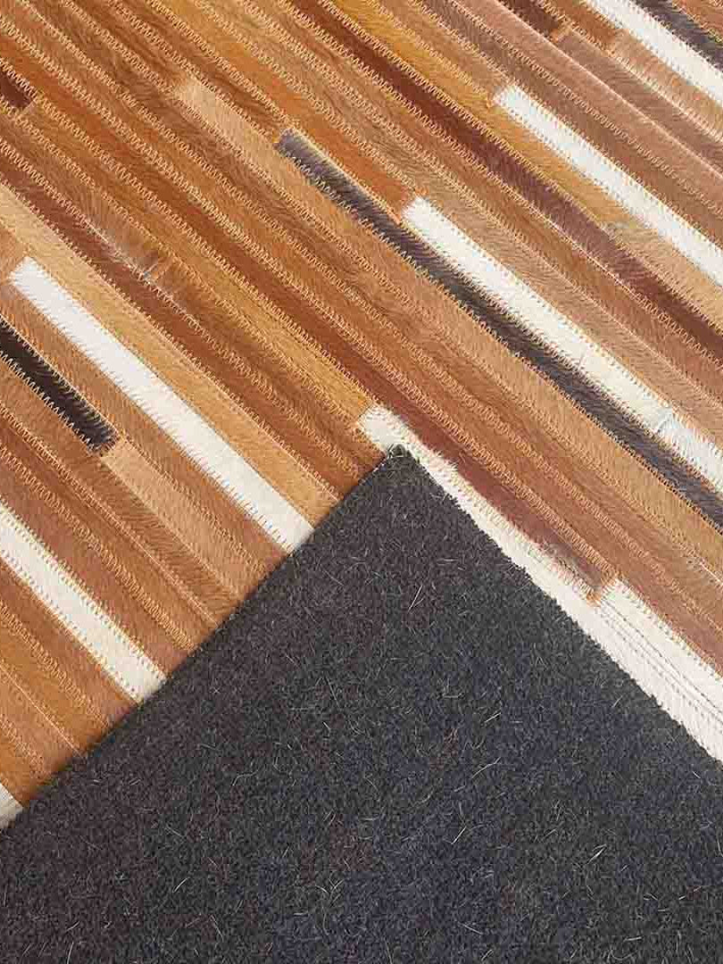 Close-up view of the backside of handmade leather rug LR-014 showing fine stitching and detailed craftsmanship